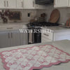 Watershed affordable quick-dry dish mat in use, highlighting its ultra-absorbent and antibacterial features. Perfect for drying dishes, glasses, and utensils on a stylish, easy-to-clean kitchen mat that enhances countertop organization. Pink bow mat, coquette. 